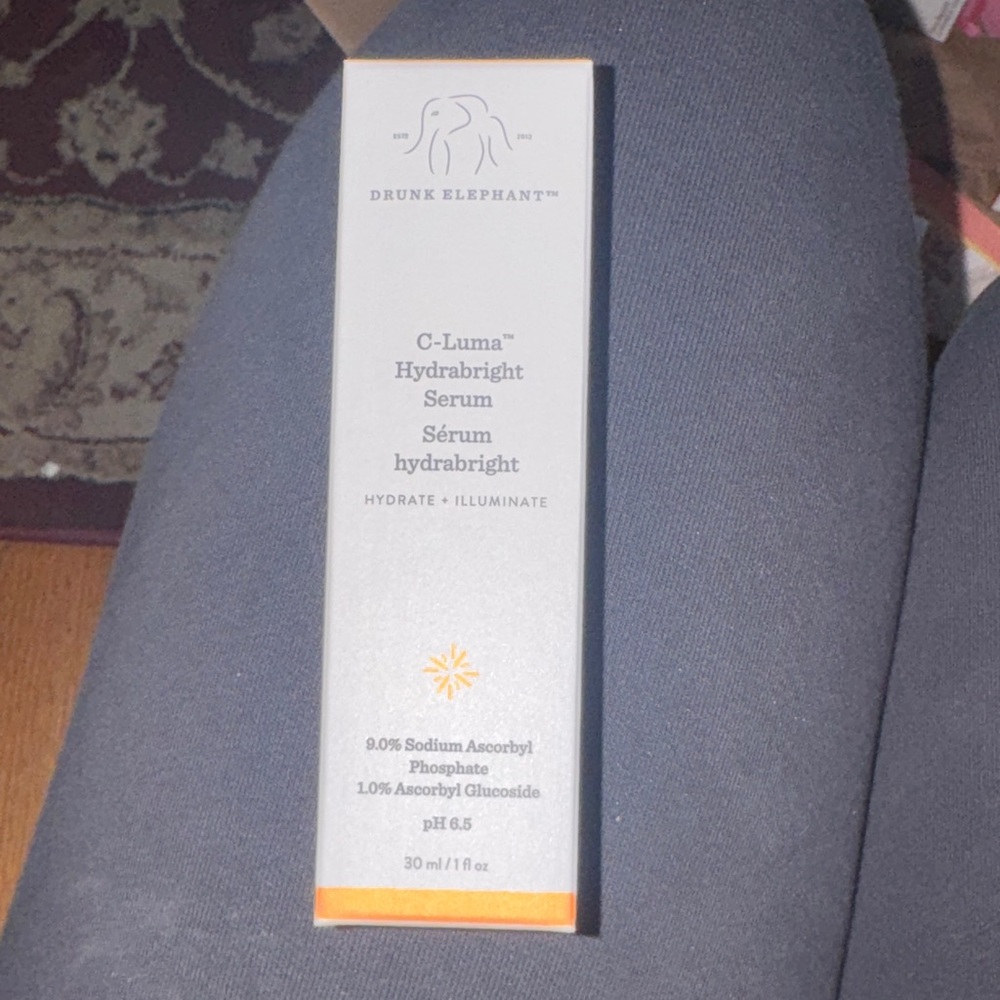Drunk Elephant C-Luma Hydrabright Serum in Gray and Orange
